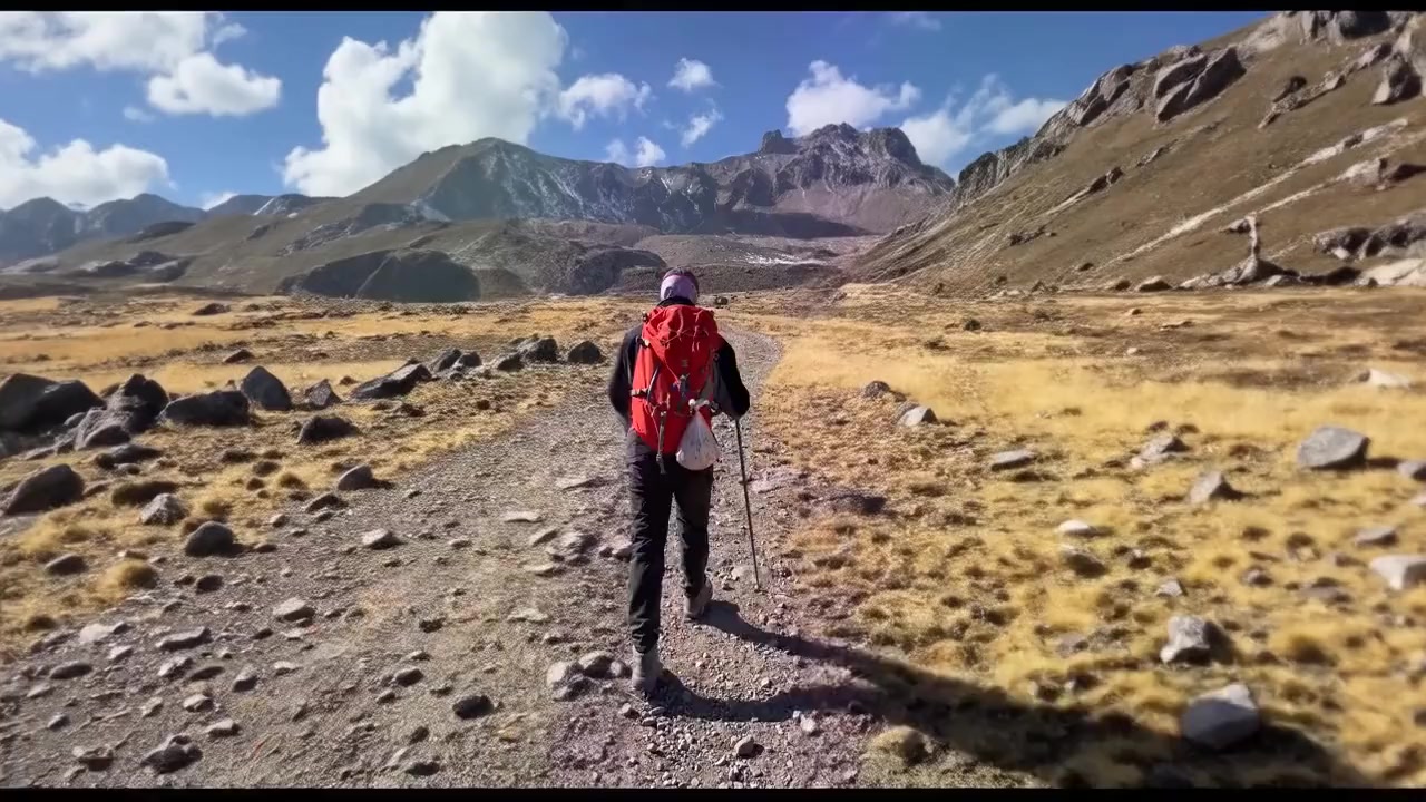 Portrait to landscape: a mountain trail: frame from the AI-expanded result